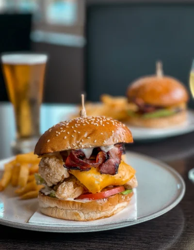 Chicken Burger buttermilk chicken breast, bacon, lettuce, American cheese, bbq mayo, steak chips